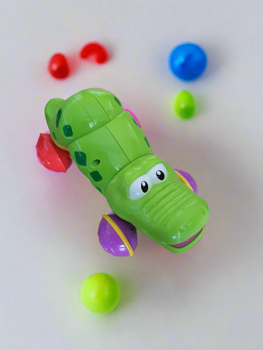 Press & Roll Crocodile Toy – Self-Retracting Action!