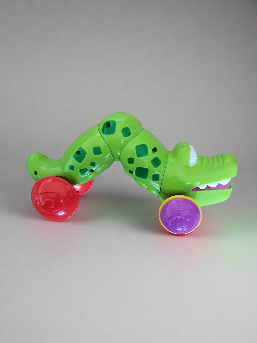 Press & Roll Crocodile Toy – Self-Retracting Action!
